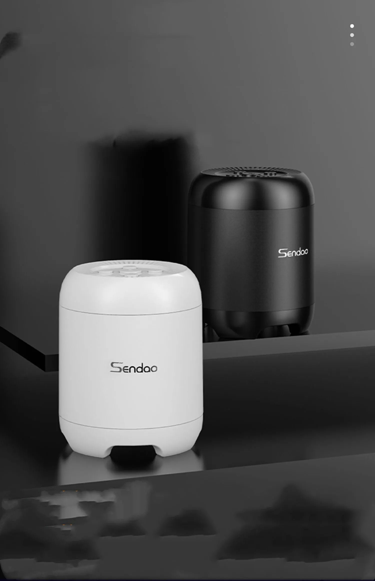 Compact black or white wireless Bluetooth speaker with card reader slot and USB port.