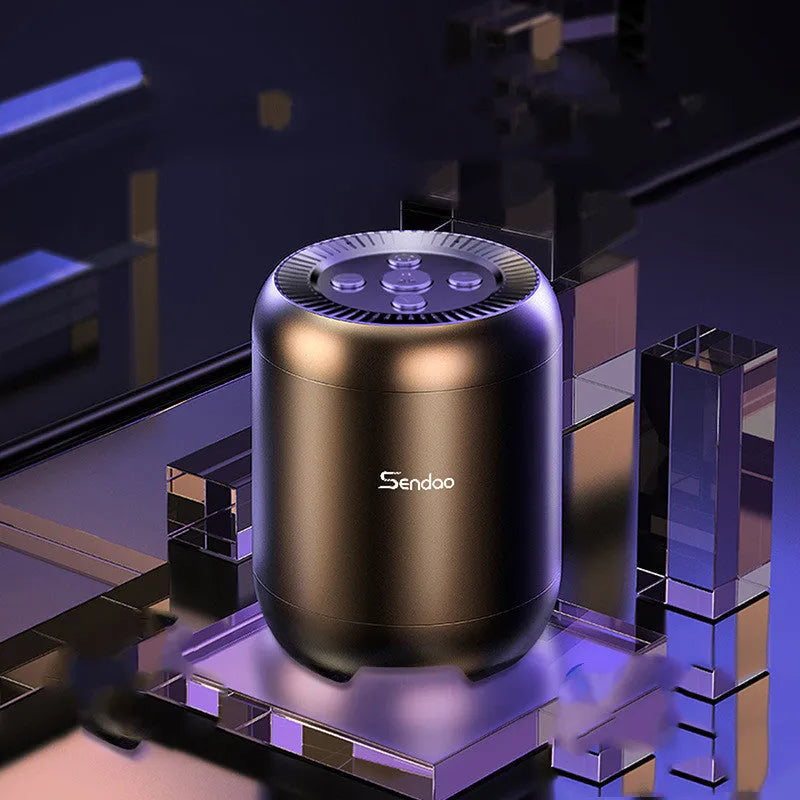 Compact black or white wireless Bluetooth speaker with card reader slot and USB port.