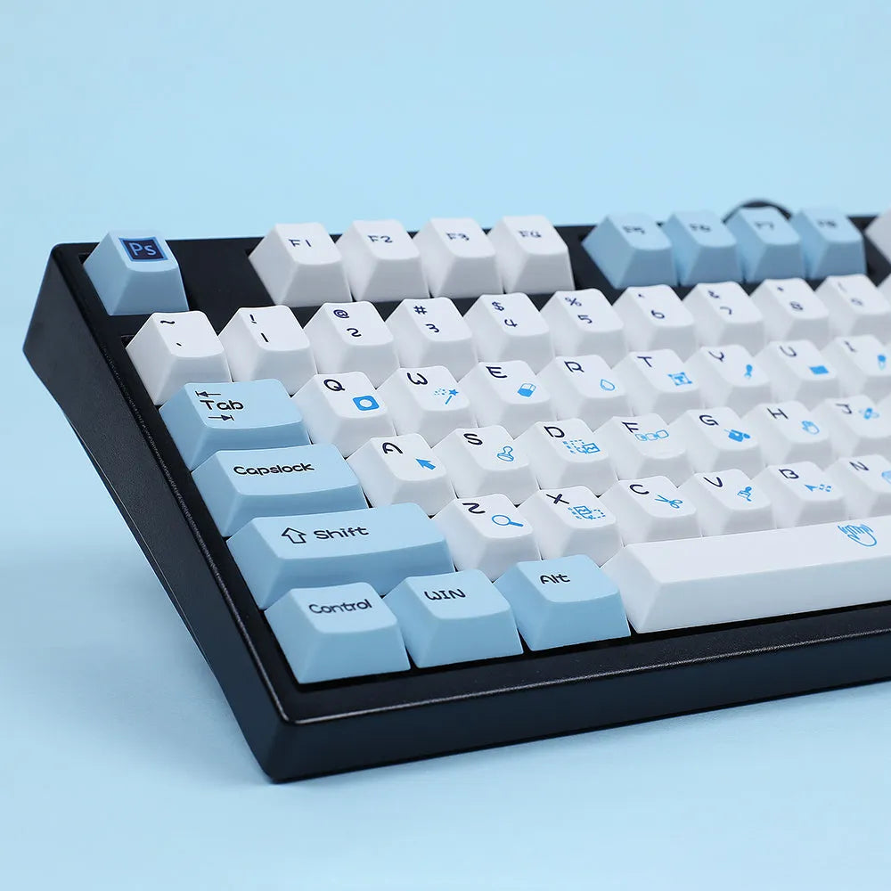 PlayStation-themed mechanical keyboard keycaps in blue and white or grey and white colour schemes