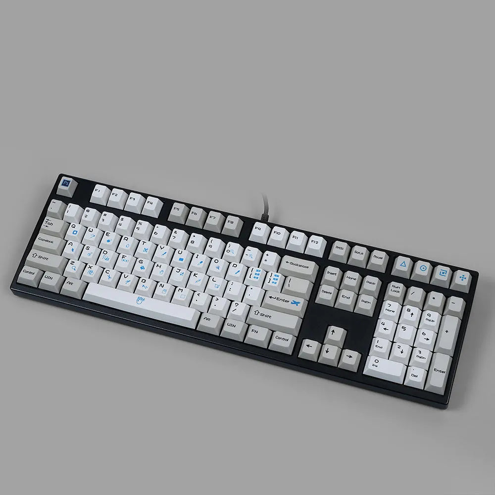 PlayStation-themed mechanical keyboard keycaps in blue and white or grey and white colour schemes