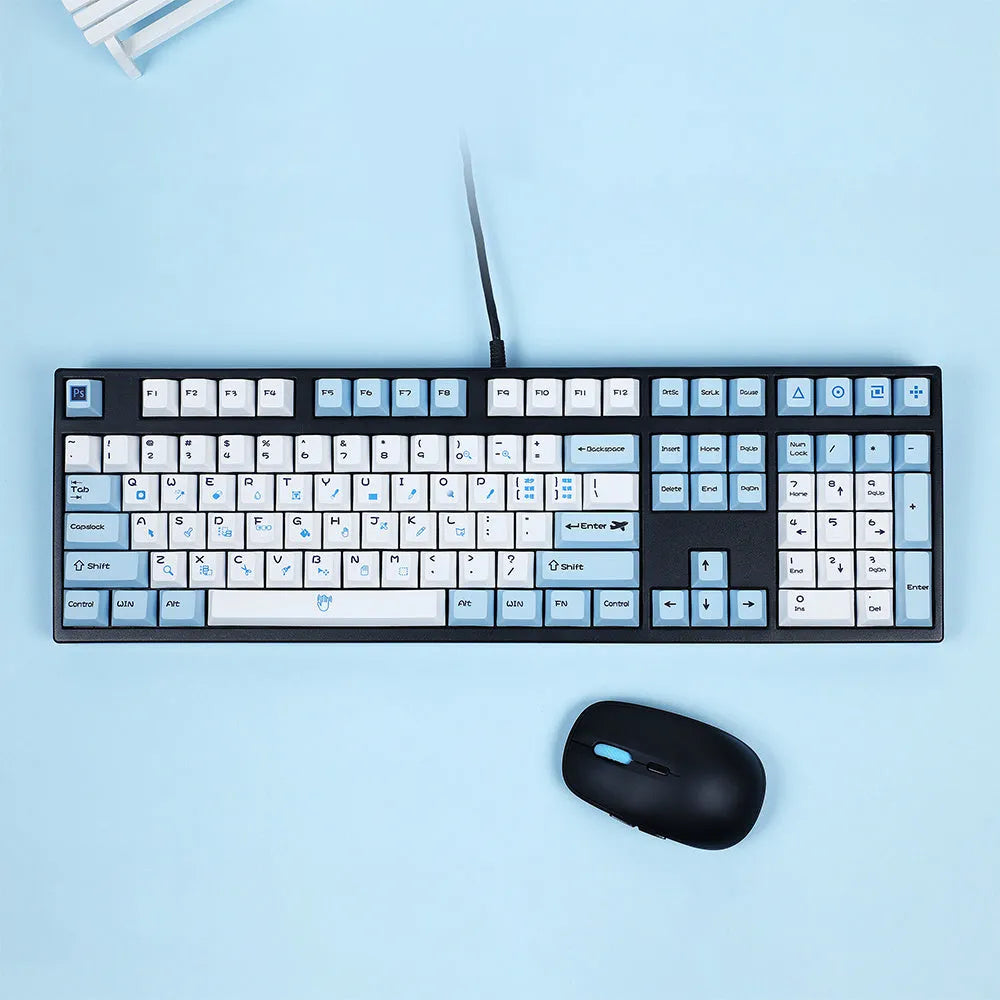PlayStation-themed mechanical keyboard keycaps in blue and white or grey and white colour schemes