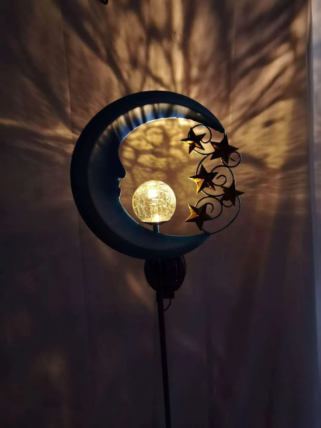 Blue moon shaped solar lawn light with wrought iron frame and crack glass ball LED