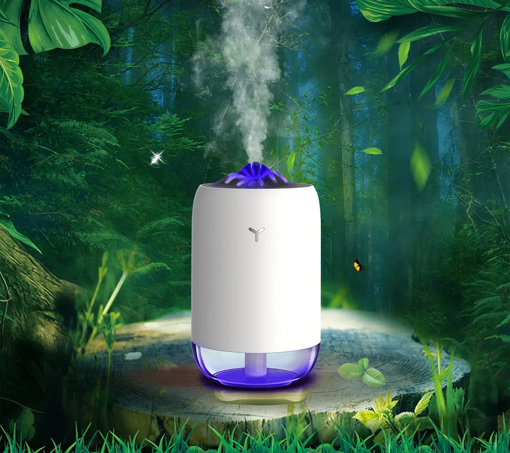 Magic Flame columnar humidifier in light blue colour on desktop with USB cable