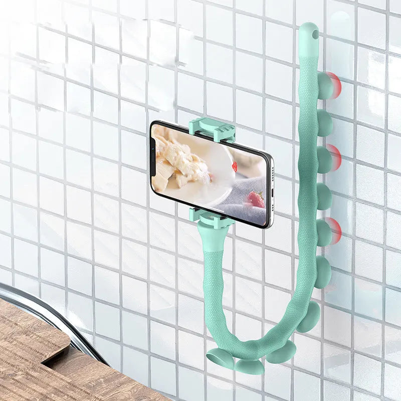 Black flexible rubber phone holder with suction cup base bent into an L-shape