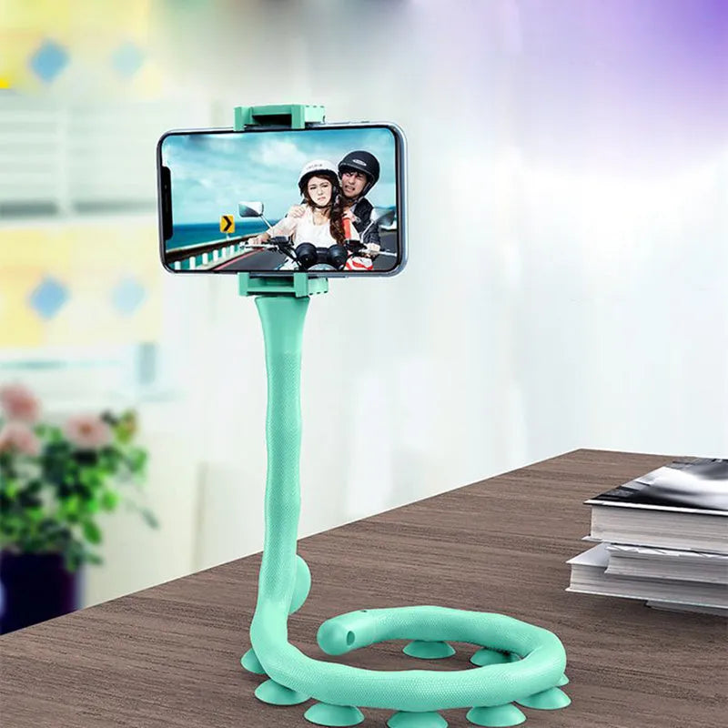 Black flexible rubber phone holder with suction cup base bent into an L-shape