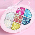 Small pot of glitter eye shadow gel cream with shimmer sequins in seven colour options for face and body festival use
