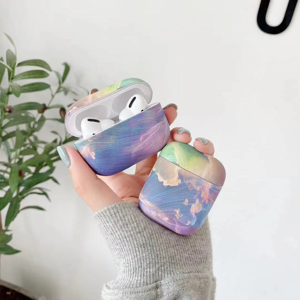 Hard shell plastic protective case for Apple AirPods with watercolour design in pink and blue options