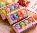 Cartoon eraser set with 12 character shapes including ice cream cones, doughnuts, and lollipops for children