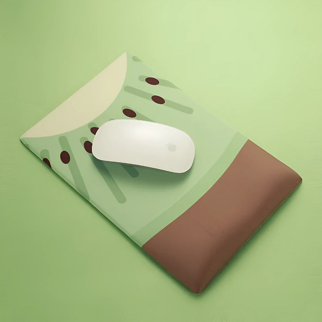 Pink and white cute creative girl design silicone wrist mouse pad on a desk.