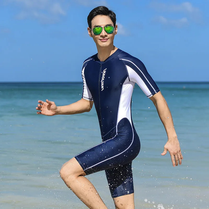 Men's black short-sleeved five-point surfing wetsuit with front zip on grey background
