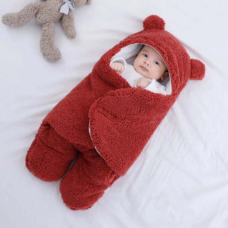 Baby quilted sleeping bag wrapper in a light blue colour showing its quilted pattern and size.