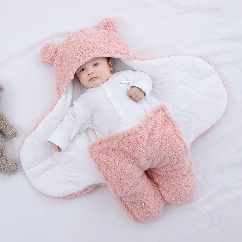 Baby quilted sleeping bag wrapper in a light blue colour showing its quilted pattern and size.
