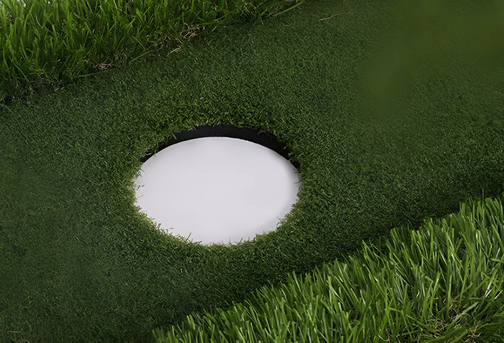Green golf training mat on a flat surface showing PP grass texture and EVA base.