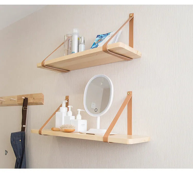 Nordic style pine wood wall mounted storage shelf for remote controls and small items.