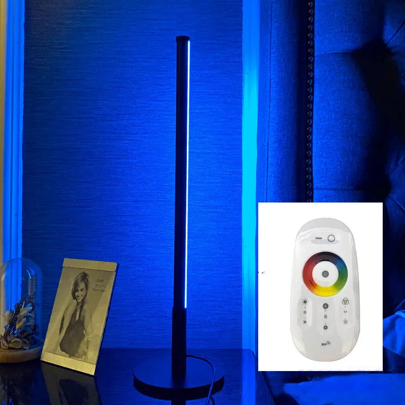 Black Nordic minimalist LED bedside lamp with RGB lighting and remote control on table