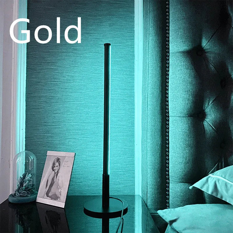 Black Nordic minimalist LED bedside lamp with RGB lighting and remote control on table
