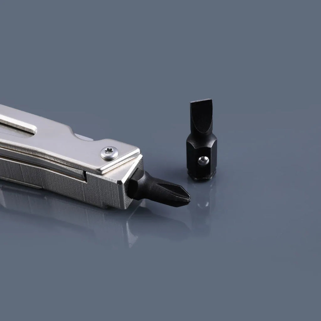 White stainless steel multi-function tool with wrench, knife, and needle nose pliers on a 13 cm handle.