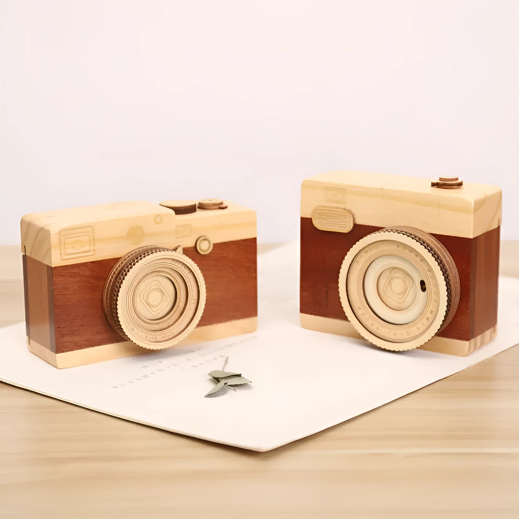 Wooden music box with a rotating camera design on a pine wood base.