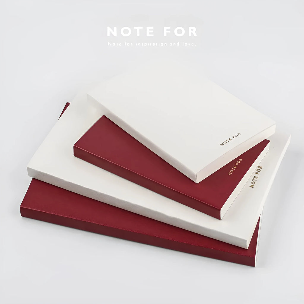Simple retro A5 notebook with red imitation leather cover, bronzing detail, and dot matrix pages