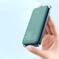Mint green magnetic wireless charging power bank showing dimensions and MagSafe compatibility