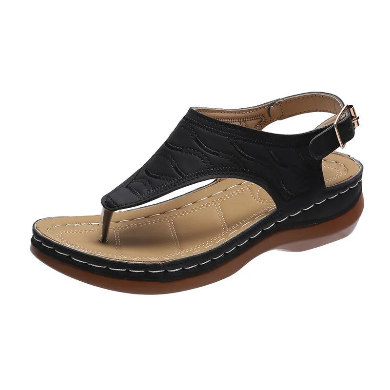 Women's red wedge heel sandals with an adjustable buckle strap on a white background