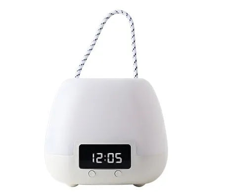 White rechargeable remote control night light on a bedside table with projection mode on