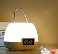 White rechargeable remote control night light on a bedside table with projection mode on