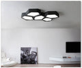 Geometric shaped LED light panel with iron frame in black or white, remote control for dimming