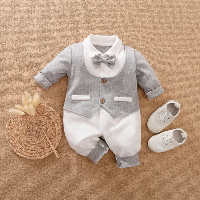 Baby boy in a long-sleeved cotton jumpsuit with gentleman-style detailing for spring or autumn wear.
