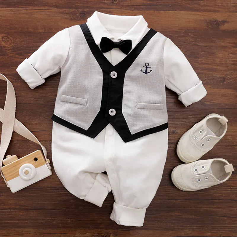 Baby boy in a long-sleeved cotton jumpsuit with gentleman-style detailing for spring or autumn wear.