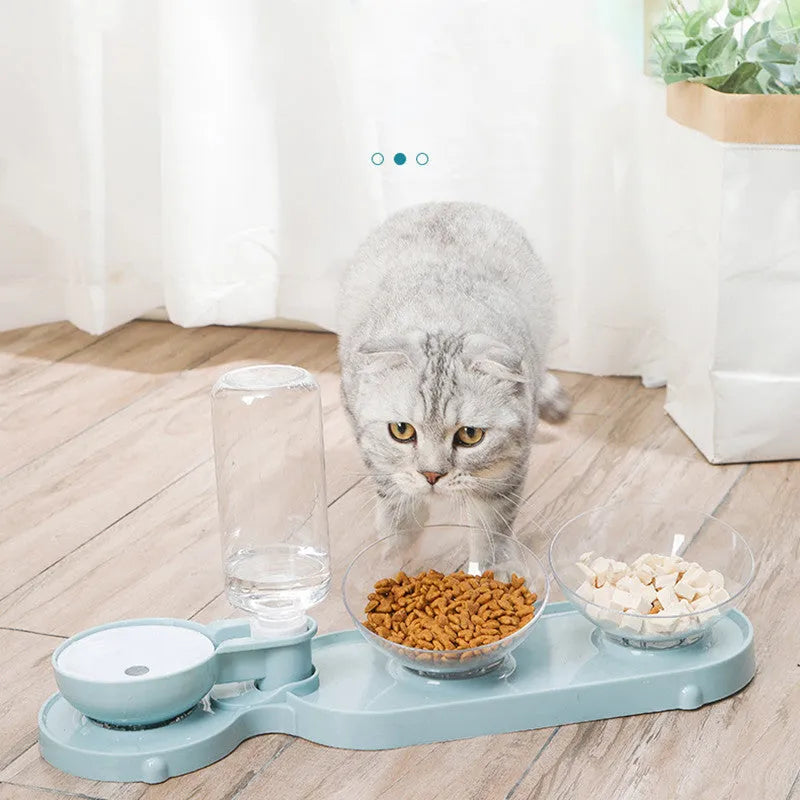 Double bowl automatic pet feeder with blue bowls and white plastic base on floor