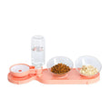Double bowl automatic pet feeder with blue bowls and white plastic base on floor