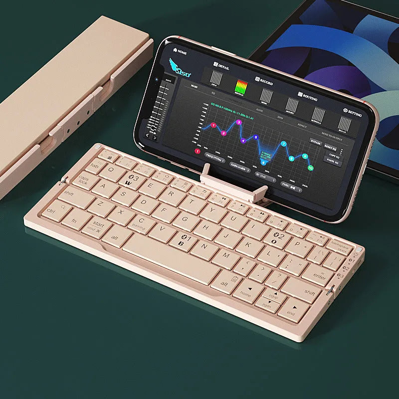 Silver white folding Bluetooth keyboard with integrated stand holding a smartphone