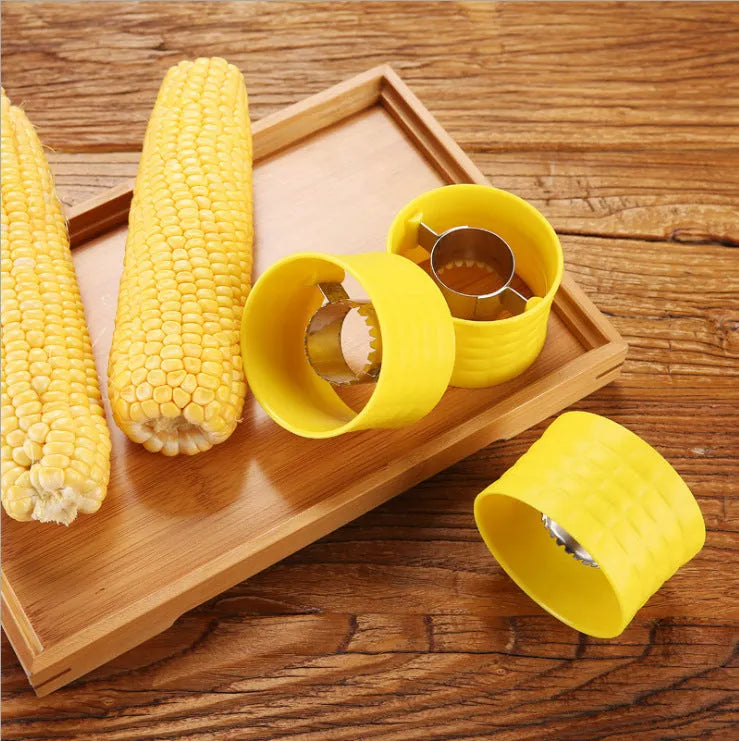 Yellow corn-shaped manual kitchen thresher tool for removing kernels from corn on the cob.