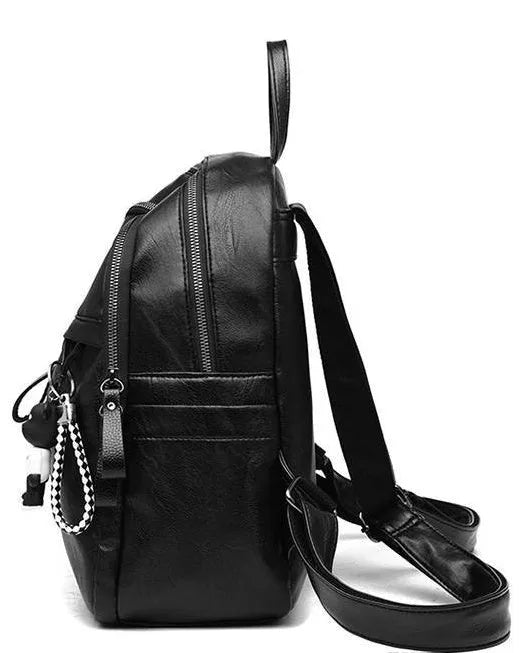 Black PU leather backpack with double straps showing internal ID bag compartment and zipper closure