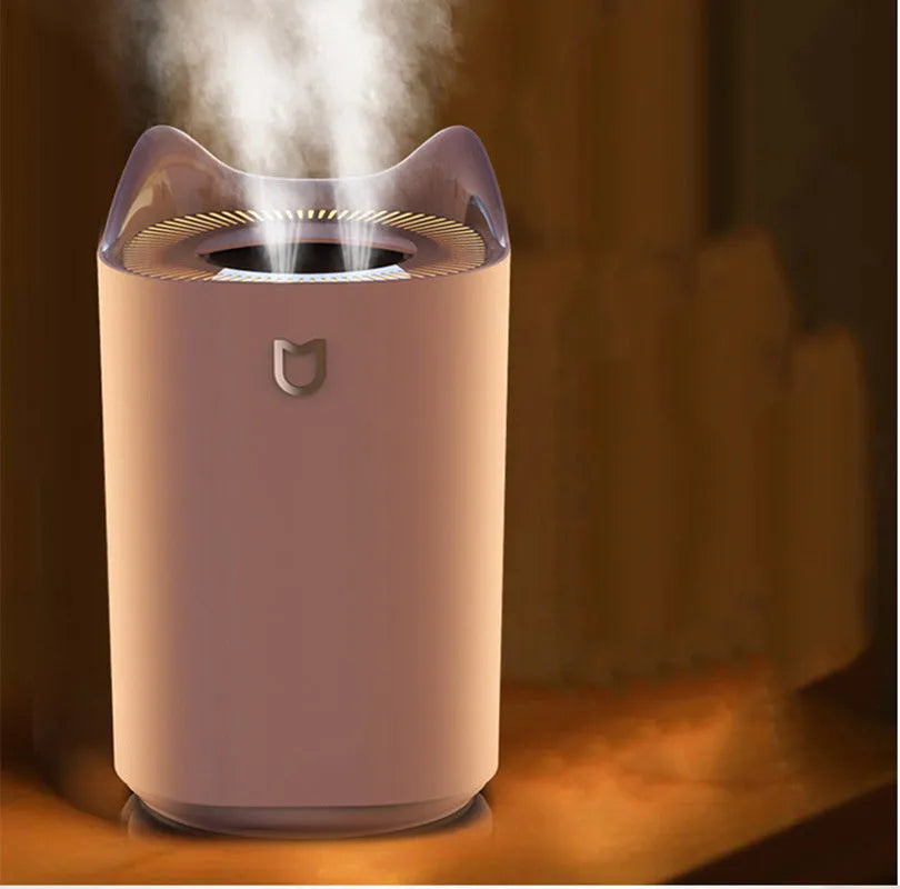 Double spray humidifier with USB cable and three mist outlets in coral pink colour