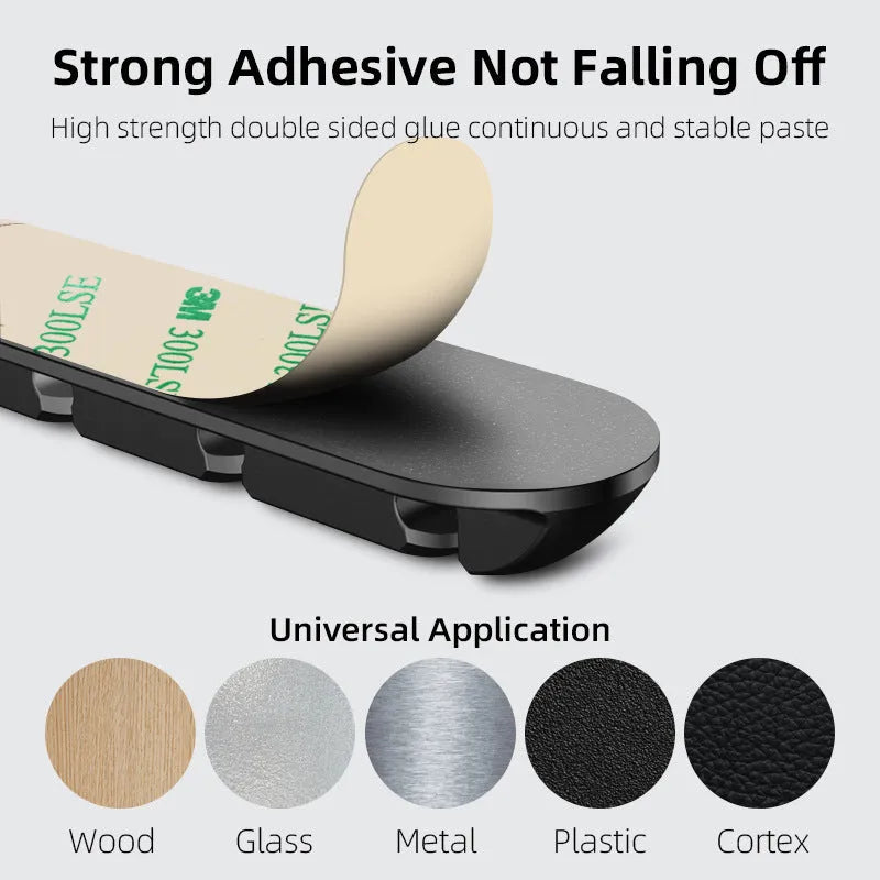 Black desktop magnetic cable organiser for charging cable storage and workspace organisation