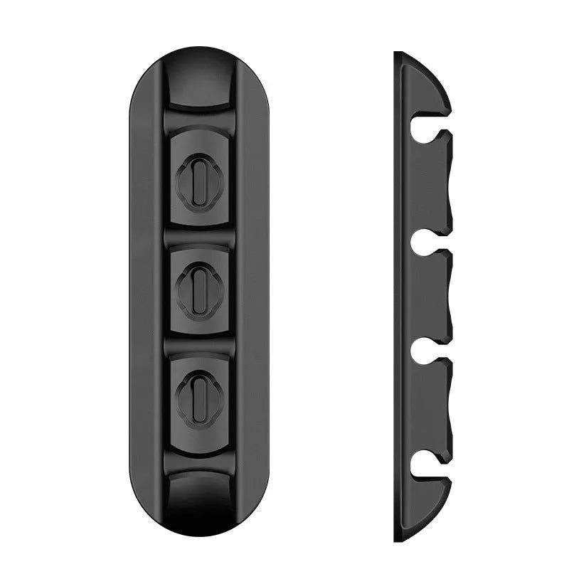 Black desktop magnetic cable organiser for charging cable storage and workspace organisation