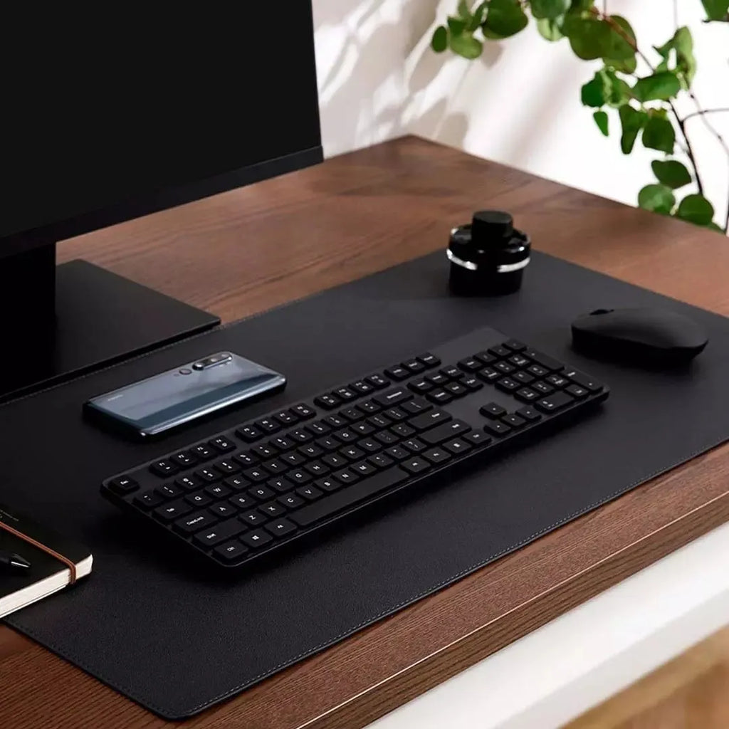 Extra large double-material waterproof mouse pad in black with storage bag on desk