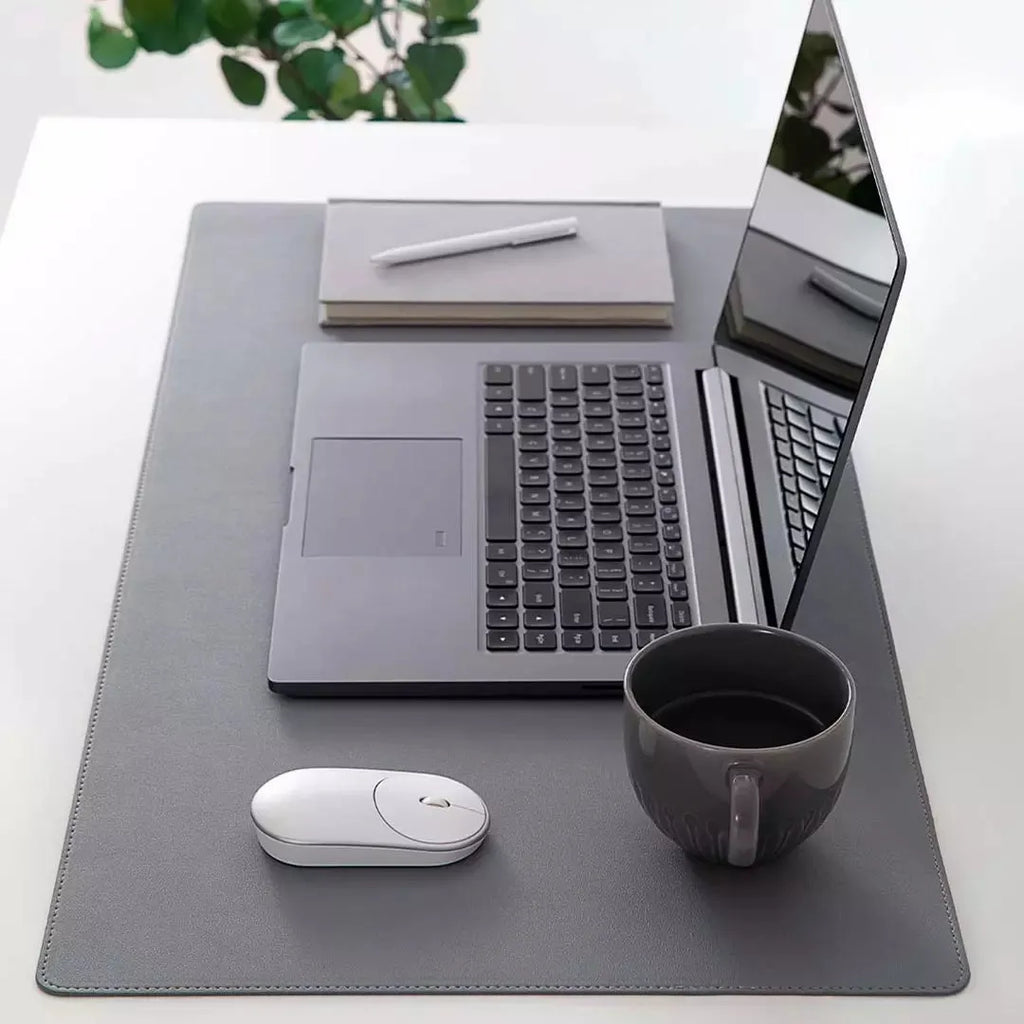 Extra large double-material waterproof mouse pad in black with storage bag on desk