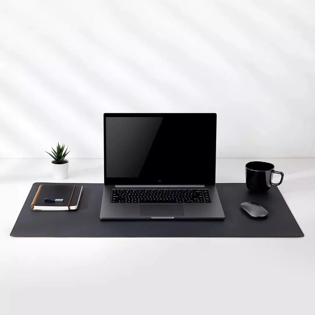 Extra large double-material waterproof mouse pad in black with storage bag on desk