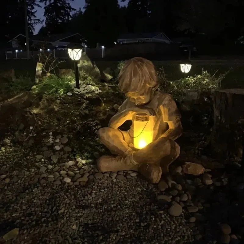 Brown natural resin tabletop figurine titled The Boy In The Garden decoration