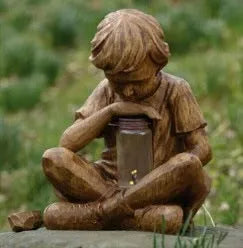 Brown natural resin tabletop figurine titled The Boy In The Garden decoration