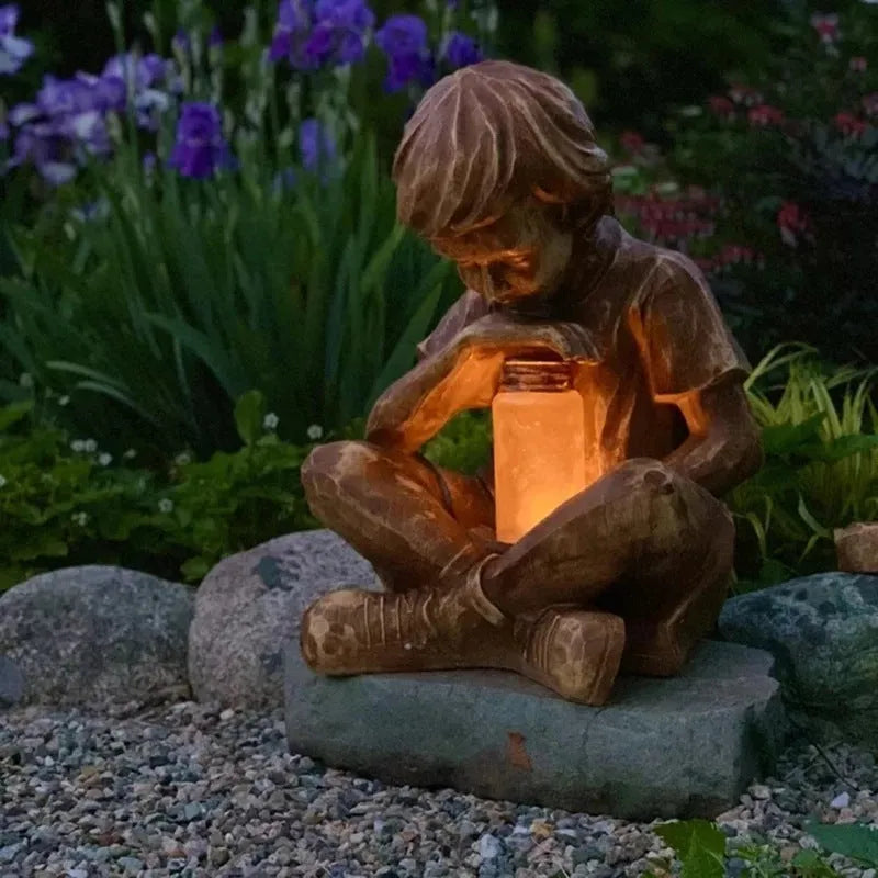 Brown natural resin tabletop figurine titled The Boy In The Garden decoration