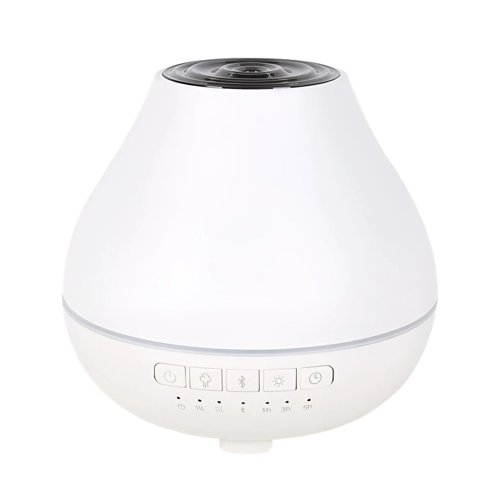 White round Bluetooth humidifier and essential oil aroma diffuser with night light on a table.