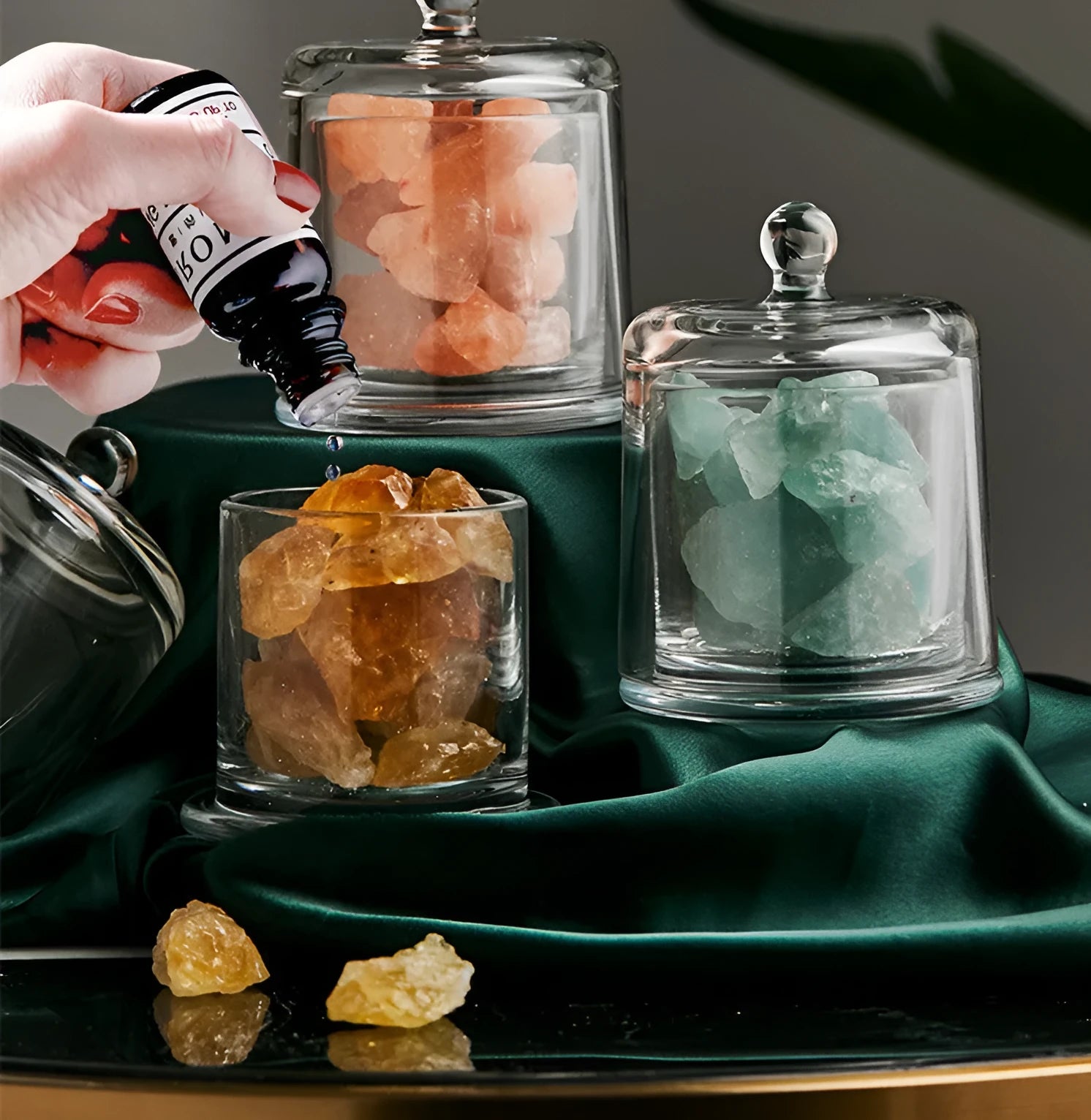 Crystal diffuser stone in pink with sesame oil bottle on a wooden surface for fire-free aromatherapy