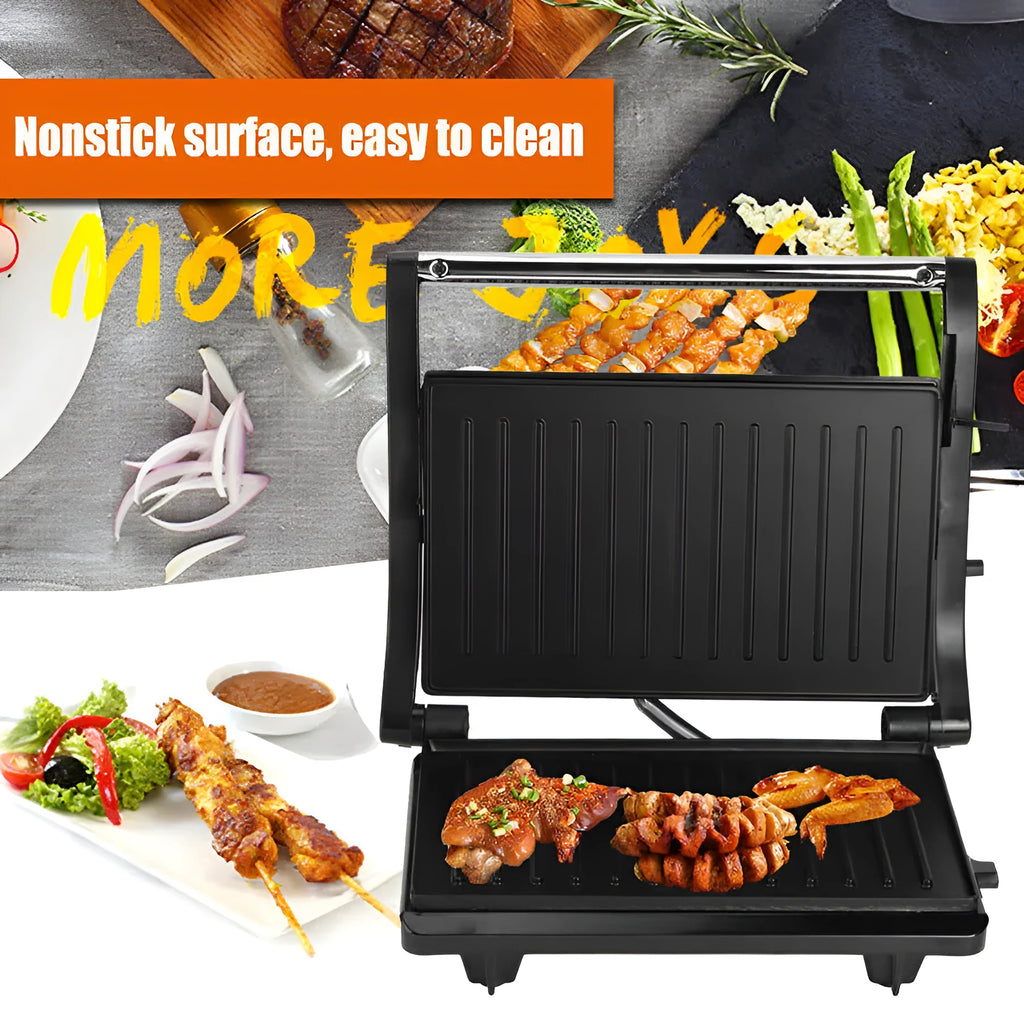 Nonstick electric steak maker grill with black casing, adjustable temperature knob, and wrap-around power cord on a kitchen worktop.