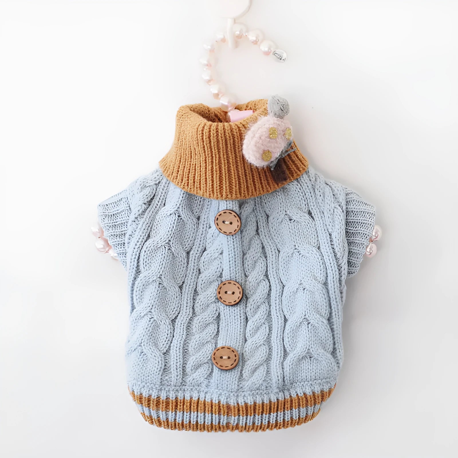 Classic knitted pet sweater for small dogs and cats in pink with twist button design