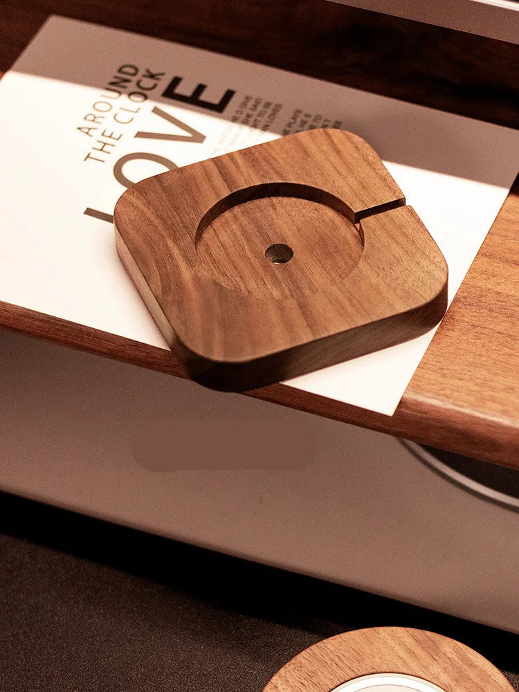 Walnut wood magnetic wireless charger base with iPhone on Magsafe charging pad