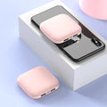 Compact black mini power bank with 20000 mAh capacity and LED flashlight on white background.